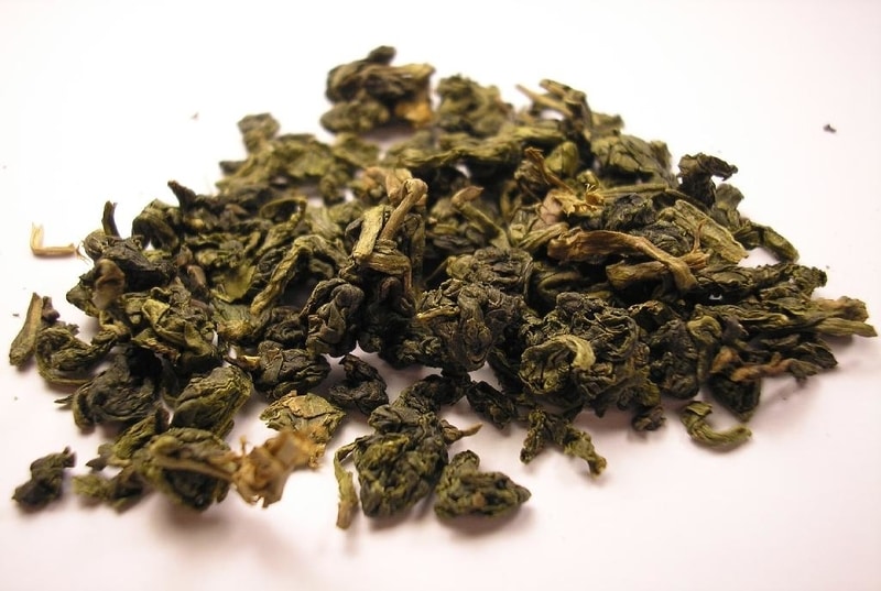 Loose leaf oolong tea resting on a white table